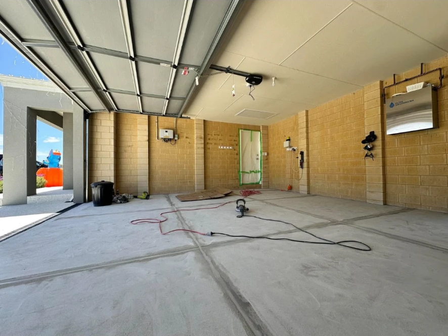 Garage with a bare concrete floor before epoxy coating