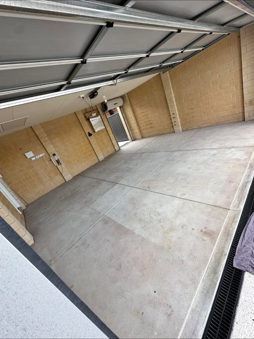 Bare concrete garage floor ready for surface preparation