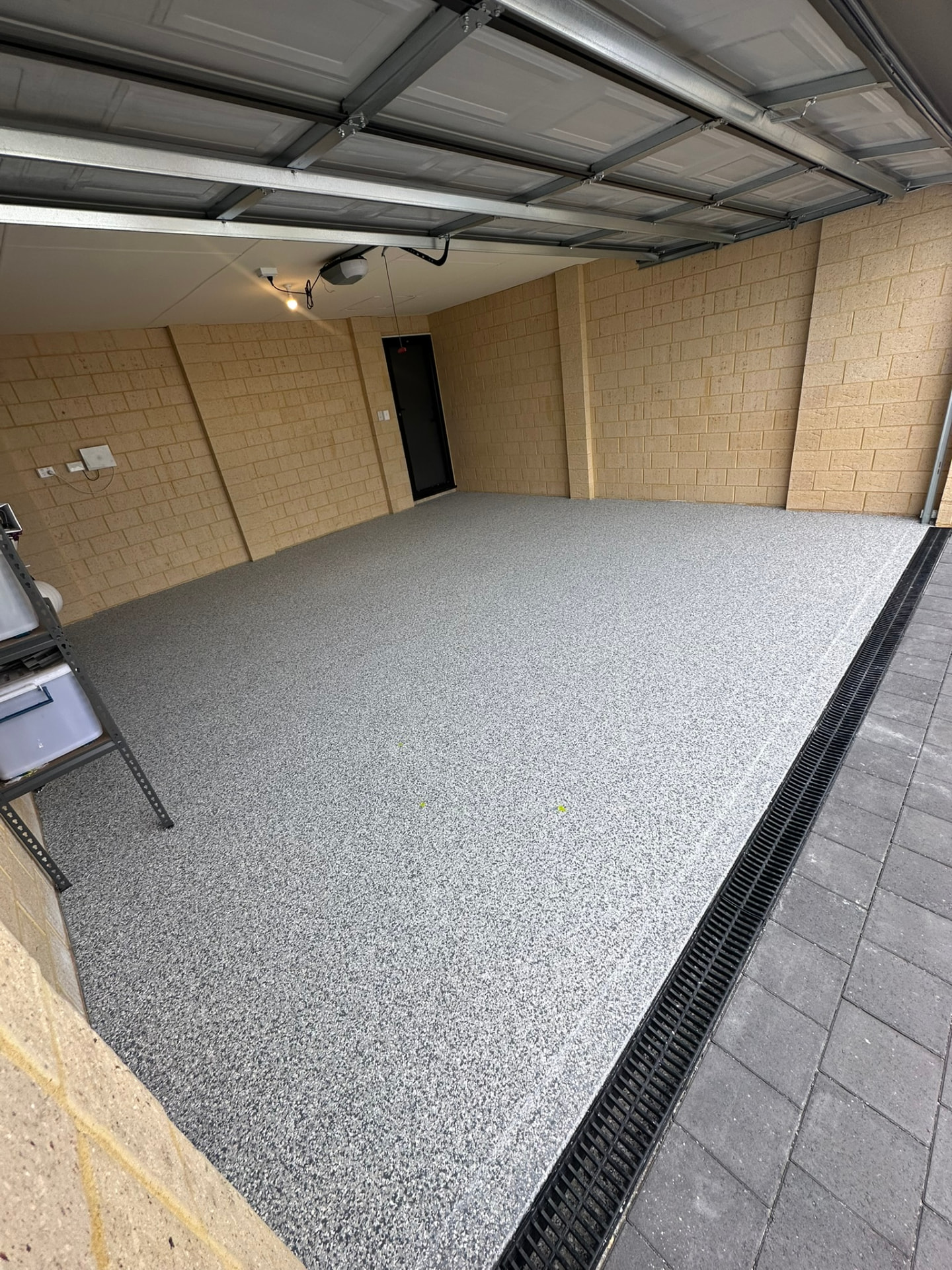 Garage epoxy flake flooring viewed from the driveway